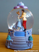 Presenting a Disney snowglobe of Cinderella as she is seen in Disney's .