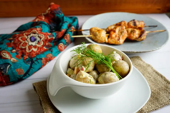 potato salad in a small white bowl.