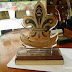 Any shape, any size. Our custom made Combo trophies are made of different materials: brass, stainless steel, acrylic, glass, wood and/or others. They take various shapes and sizes. You can either give us your own design and specifications or we can depend on your own guidelines to come up with a design that suits your taste and need. There are many different ways to implement designs onto a combo trophy, for instance you can choose to engrave a part, sandblast other parts and cut others in a special shape. You can as well choose to mount a medal (and/or other accessories) or integrate it within the body of your trophy. Cubes, spheres, cylinders and other shapes of different dimensions constitute the building blocks of our combo trophies, you can imagine and choose any arrangement of those basic elements and we can make it for you. www.medalit.com Absi Co