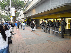Riot police outside an Éxito supermarket in Bogotá during a peaceful rally in the city recently