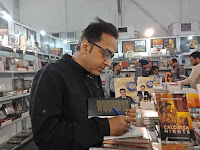 Rajat Chaudhuri signing his books at Kolkata Book fair