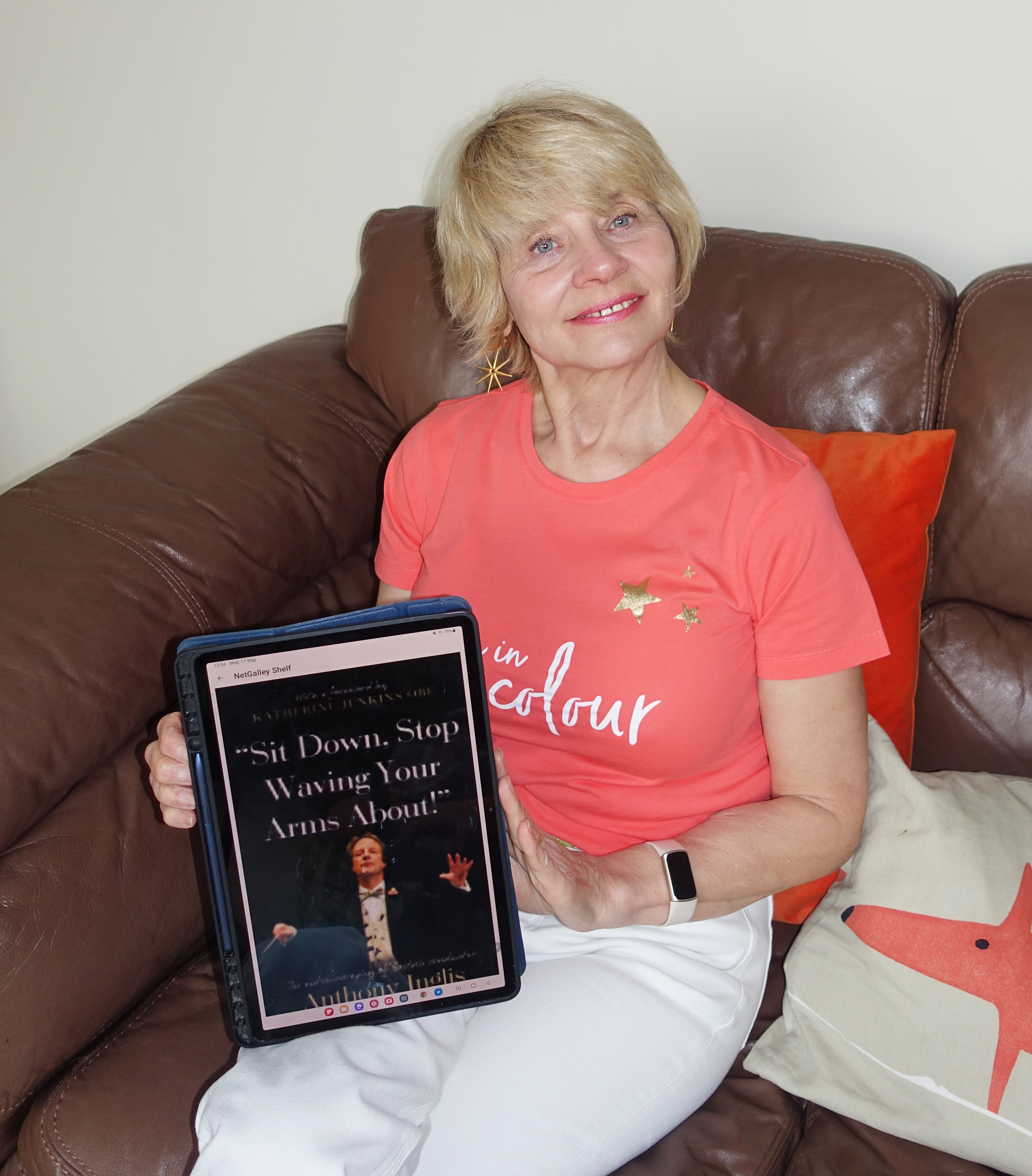 Book, fashion and beauty blogger Gail Hanlon from Is This Mutton reads a book on her tablet