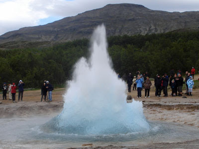 Strokkur, Iceland's old faithful geysir, at the start of its eruption