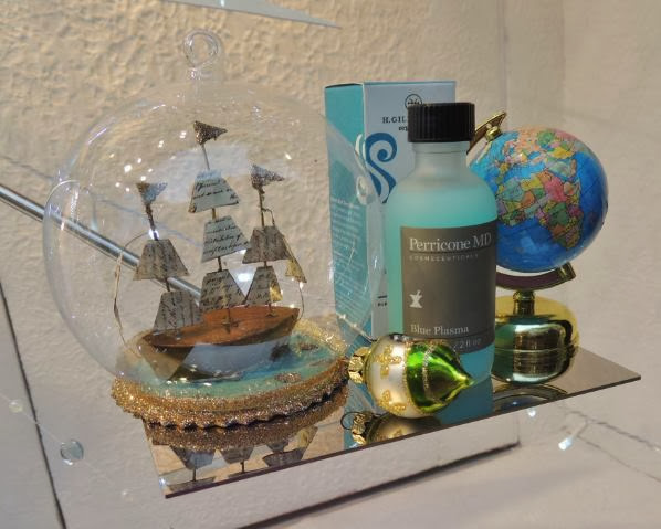 Globe, ship in a bottle and toiletries in Christmas 2013 display