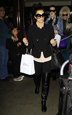 Kim and Khloe Kardashian Arriving on a flight at LAX Airport Pics