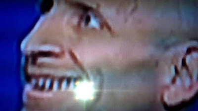 A Reptilian shape changer being interviewed on TV.