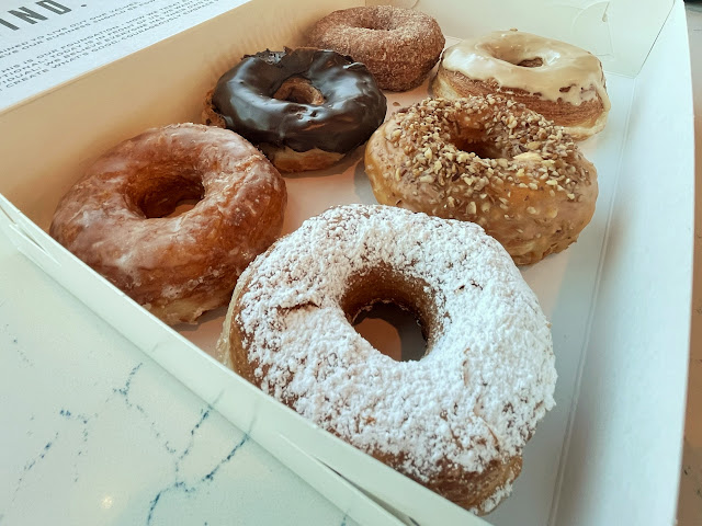 a variety box of donuts from Nightlight Donuts and Coffee