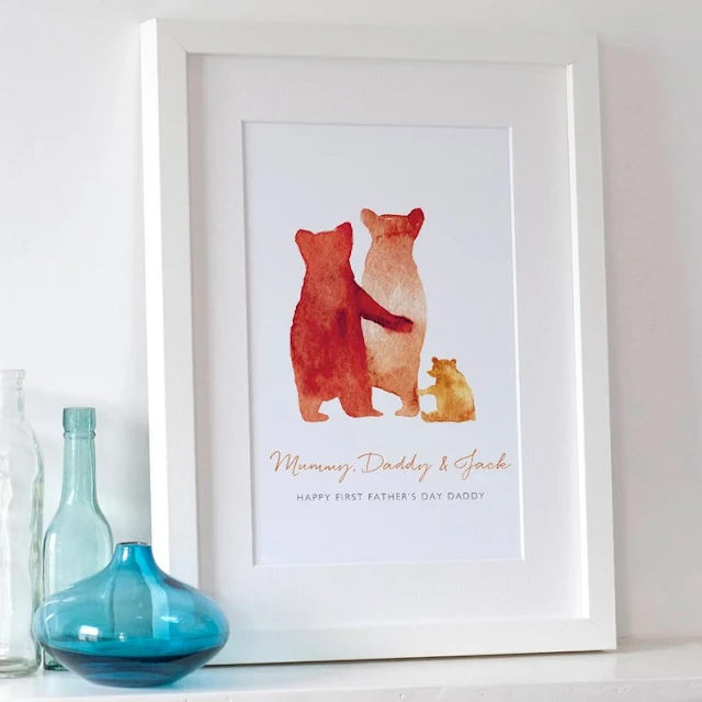 An image from the Etsy shop selling Family bear prints showing a framed print with orange watercolour style bears and text underneath saying: Mummy, Daddy & Jack. Happy First Father's Day Daddy