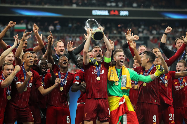 Liverpool players lifting the UEFA super cup trophy after beating Chelsea on penalties in Istanbul on August 14th, 2019