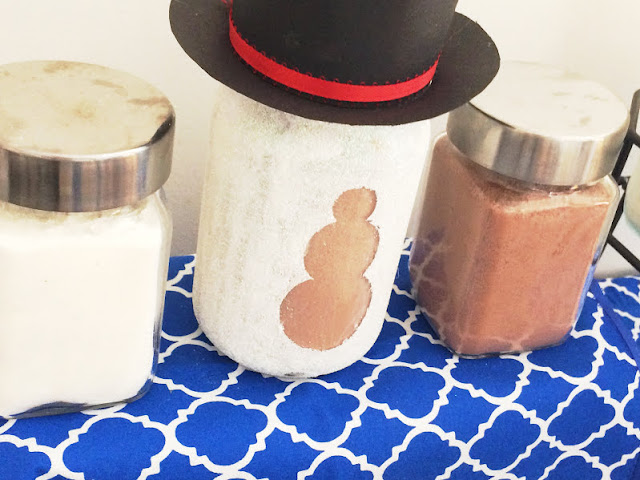 Keep warm this winter with a hot chocolate bar that will be as cute as it is helpful. With just a few items you may already have, you can make a super cute Snowman Hot Chocolate bar that will keep you warm when it's cold outside with a warm cup of cheer.