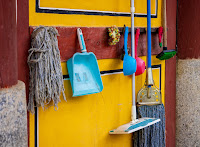 Photo of a wall rack of cleaning utensils - how thrilling