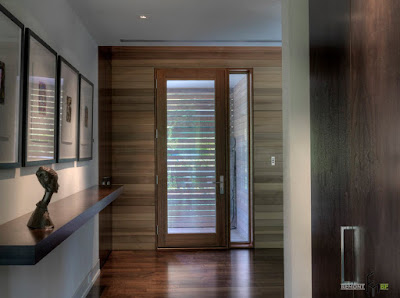 wooden front door with glass inserted