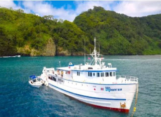 Undersea Hunter at anchor at Cocos Island