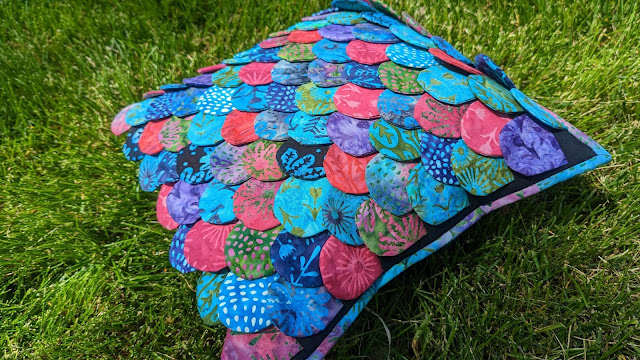 Mermaid pillow made with batik fabrics from the Hydra quilt pattern