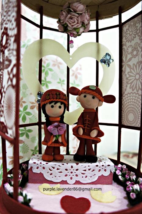 A Chinese pavilion with a couple wearing traditional chinese wedding costume