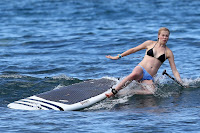 Ireland Baldwin falling off her b=paddle board