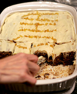 Hand Cutting Slice of Aloha Cake