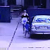 Every parent's worst nightmare: Chilling moment a man tries to abduct a little girl from the back of a car - after her mother left her alone for just 30 SECONDS