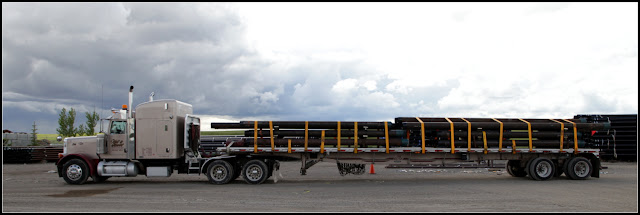 Peterbilt 379 with flatdeck and load of pipes in Calgary