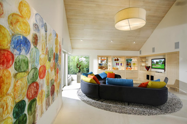 fresh and lively living room design with attractive wall art in this contemporary home design