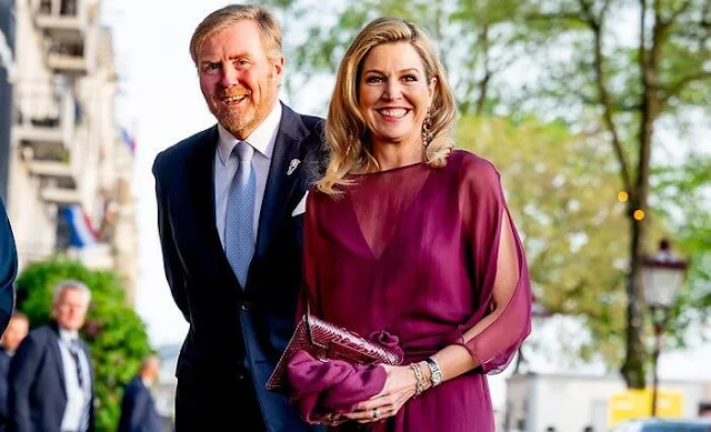 Queen Maxima wore a new burgundy Odirc silk muslin top, and Oscar pareo trousers by Natan Couture. Natan Couture SS24 collection