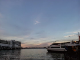 View from Viaduct, Auckland, NZ. Water and a boat.