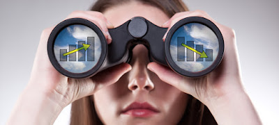 a woman is looking through binoculars that show up-and-down graphs in the lenses