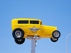 Yellow model T on pole