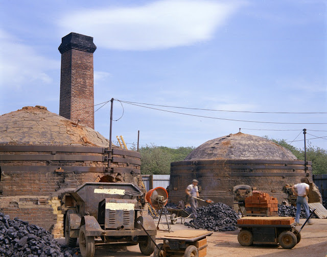 Guestling Brickworks Ltd., Three Oaks, near Hastings. Looking E. Firing of brick kilns. Specialist hand-made facing bricks are manufactured in this small brick-works. Silty loamy 'Head' is dug nearby and used as raw materials. The two kilns are of round down-draught type and are used alternately in weekly firing cycles, during which the bricks are raised to a temperature of 1200 C.