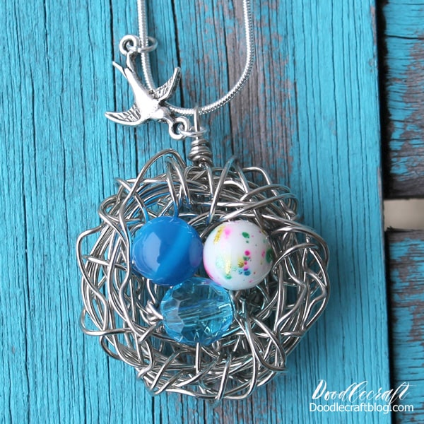 How to Make a Wire Wrapped Bird Nest Necklace!  Learn how simple it is to make a wire wrapped bird nest necklace.   This is the perfect handmade Mother's Day gift, one little bead "egg" for each of her children.   Make this bird nest necklace in less than 30 minutes.