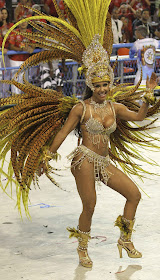 A reveller of the Vila Isabel samba school participates in the annual Carnival parade in Rio de Janeiro's Sambadrome March 6, 2011. REUTERS/Sergio Moraes.