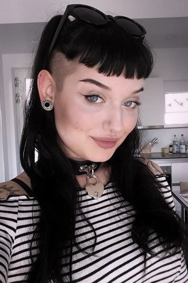 beautiful portrrait of a young woman with goth hairstyle