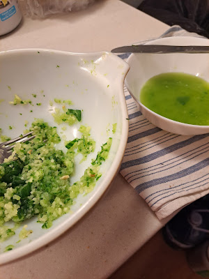 Crushed garlic and cucumber in a large bowl The drained liquid is in a second white bowl