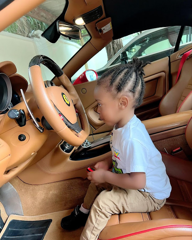 Actress Regina Daniels shares photos of her son as he takes a ride in his dad's ferrari (Photos)