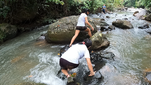 girl hikers river crossing