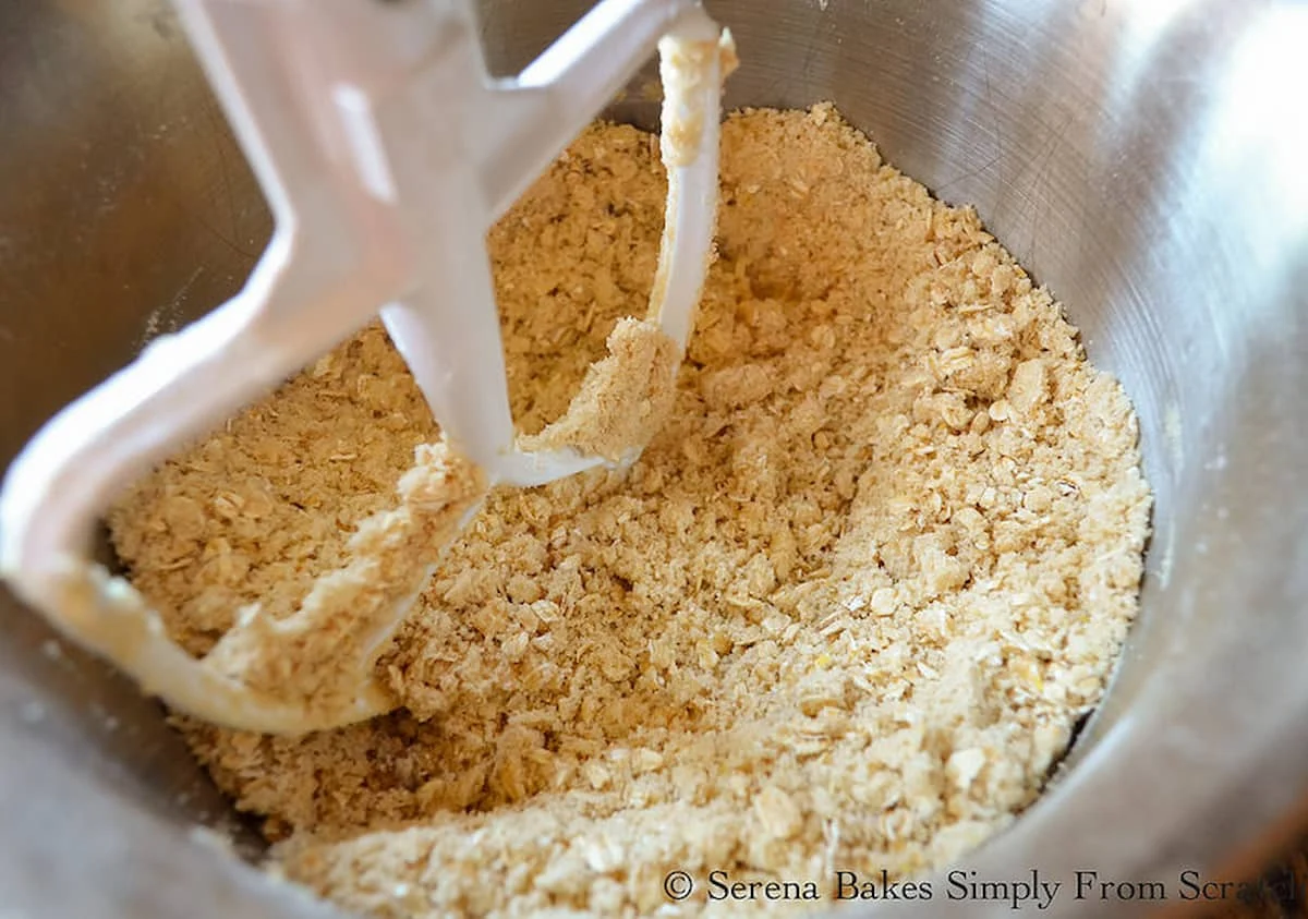 Mixed together oatmeal crumb mixture in a mixing bowl.