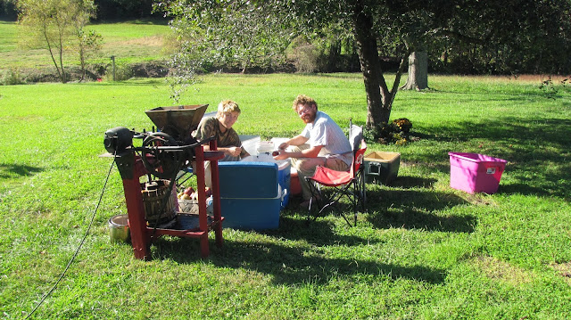 prepping apples antique cider press with modern motor