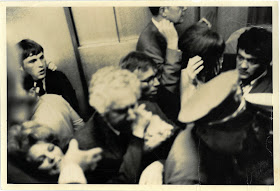 Budd Schulberg and Jimmy Breslin among a crowd in the kitchen of the Ambasador Hotel