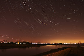 star trails with airplane lights