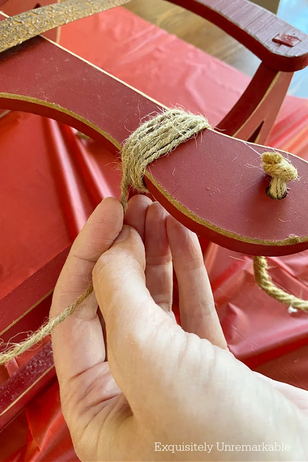 Wrapping Twine On A Christmas Sled