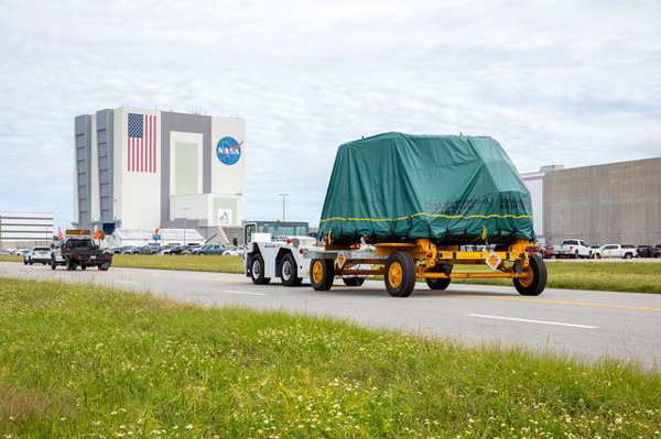 The aft skirt for one of the twin solid rocket boosters that will fly on the Artemis 2 mission is transported from the Booster Fabrication Facility to the Rotation Processing and Surge Facility at NASA's Kennedy Space Center in Florida...on September 25, 2023.