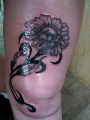 daisy tattoos pics. New Tribal Daisy Tattoo