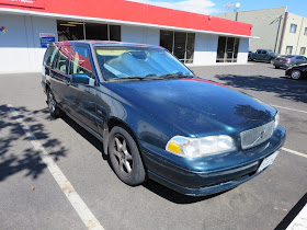 Faded, peeling paint on Volvo V70 Wagon.