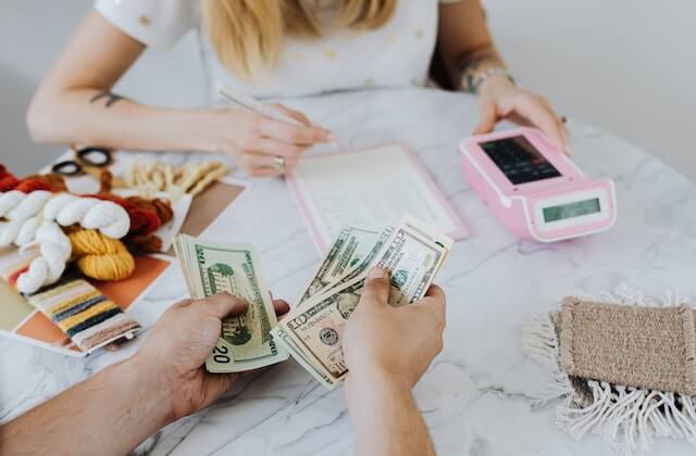Man and woman budgeting on a table
