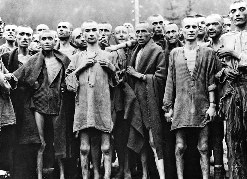 Starved prisoners, nearly dead from hunger, pose in concentration camp in Ebensee, Austria