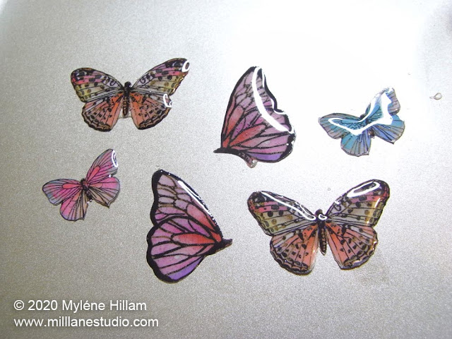Resined butterfly paper cutouts
