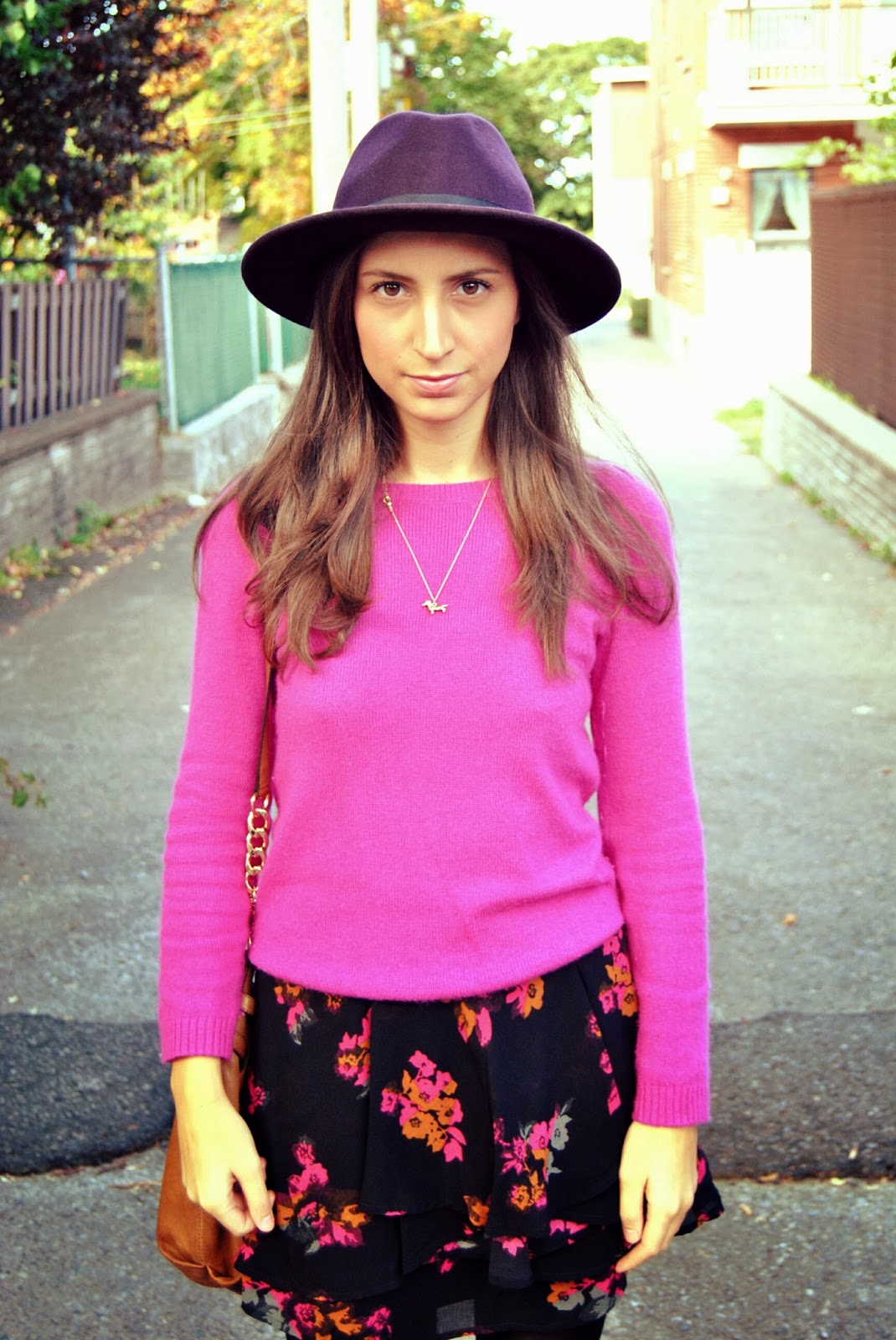 purple hat pink sweater floral skirt