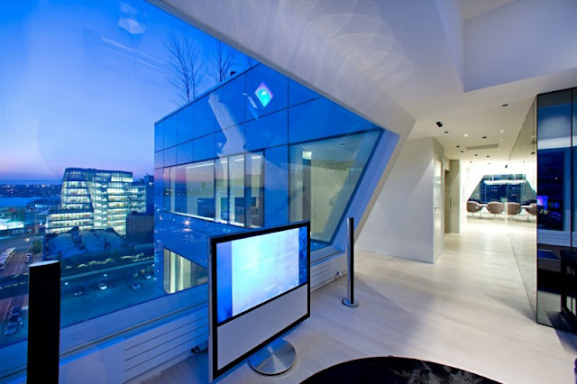 Photo of tv in the bedroom with hallway in the background in one of the modern New York pnthouses