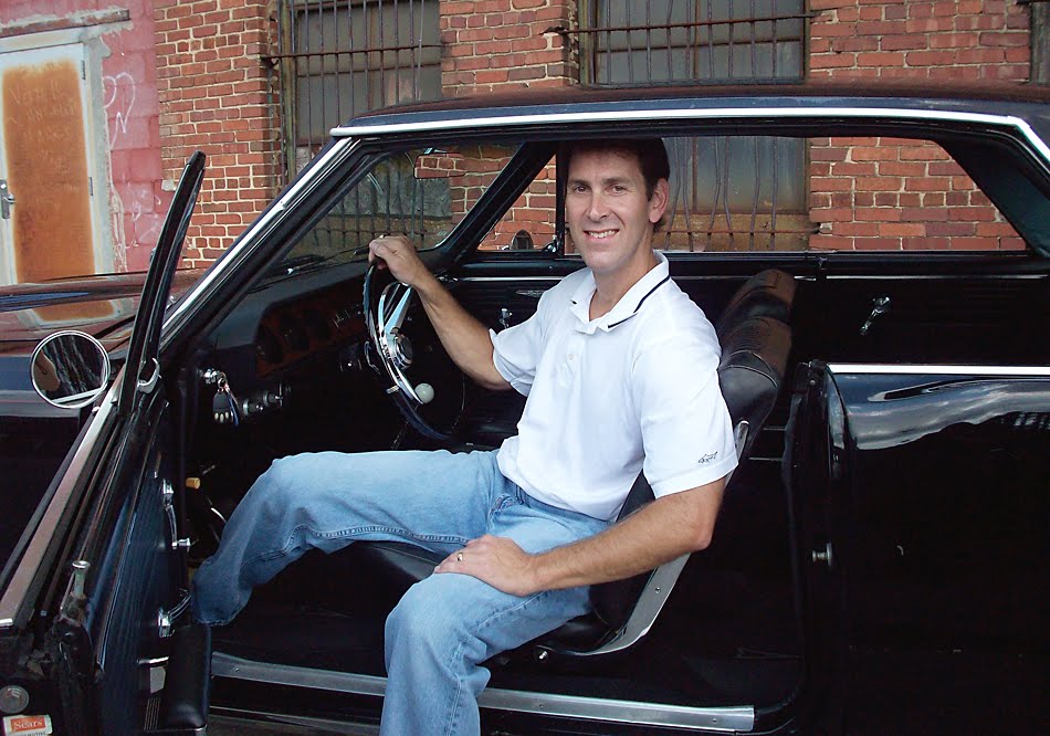 Randy Phillips at home behind the wheel of the GTO his father bought new in