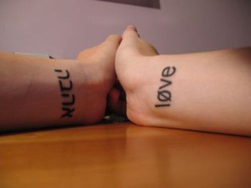  whole poems or sayings in foreign languages, word tattoos by no means 